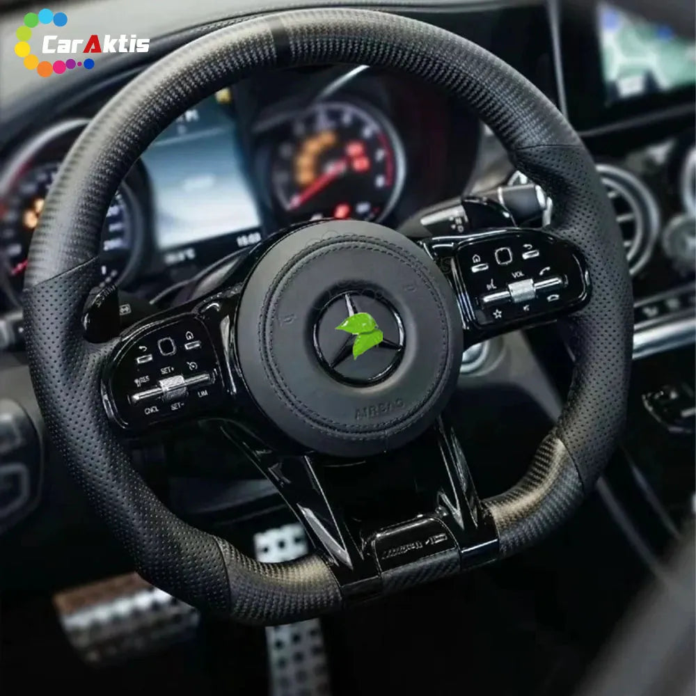 High-end custom carbon fiber steering wheel installed in a Mercedes Sprinter W910 dashboard with gloss finish.