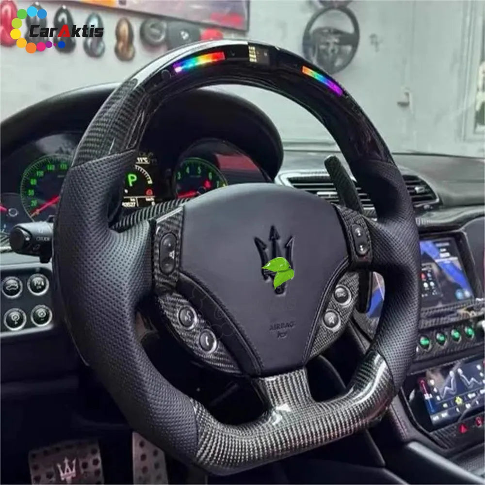 Custom carbon fiber steering wheel with RGB LED display installed in a Maserati GranTurismo interior.