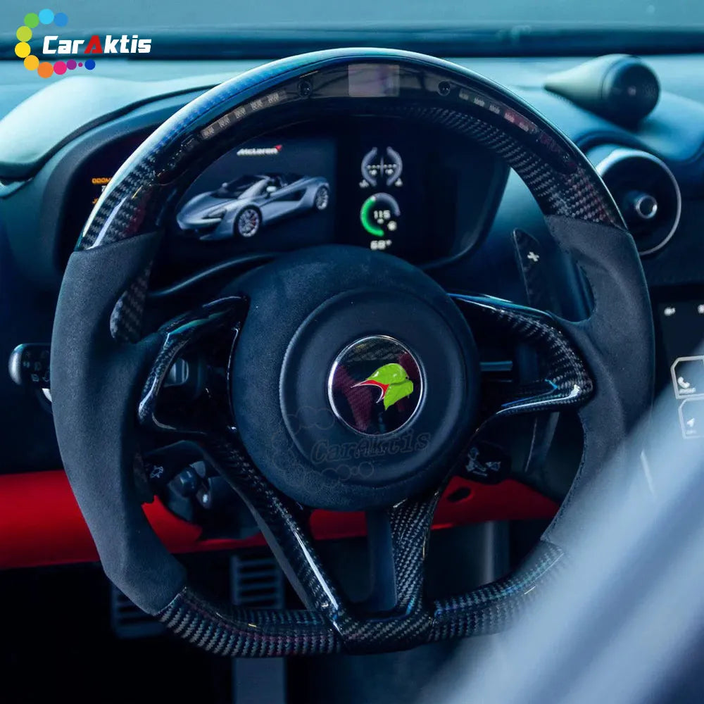 Interior view of a McLaren 600LT featuring a custom carbon fiber steering wheel with digital LED RPM display.