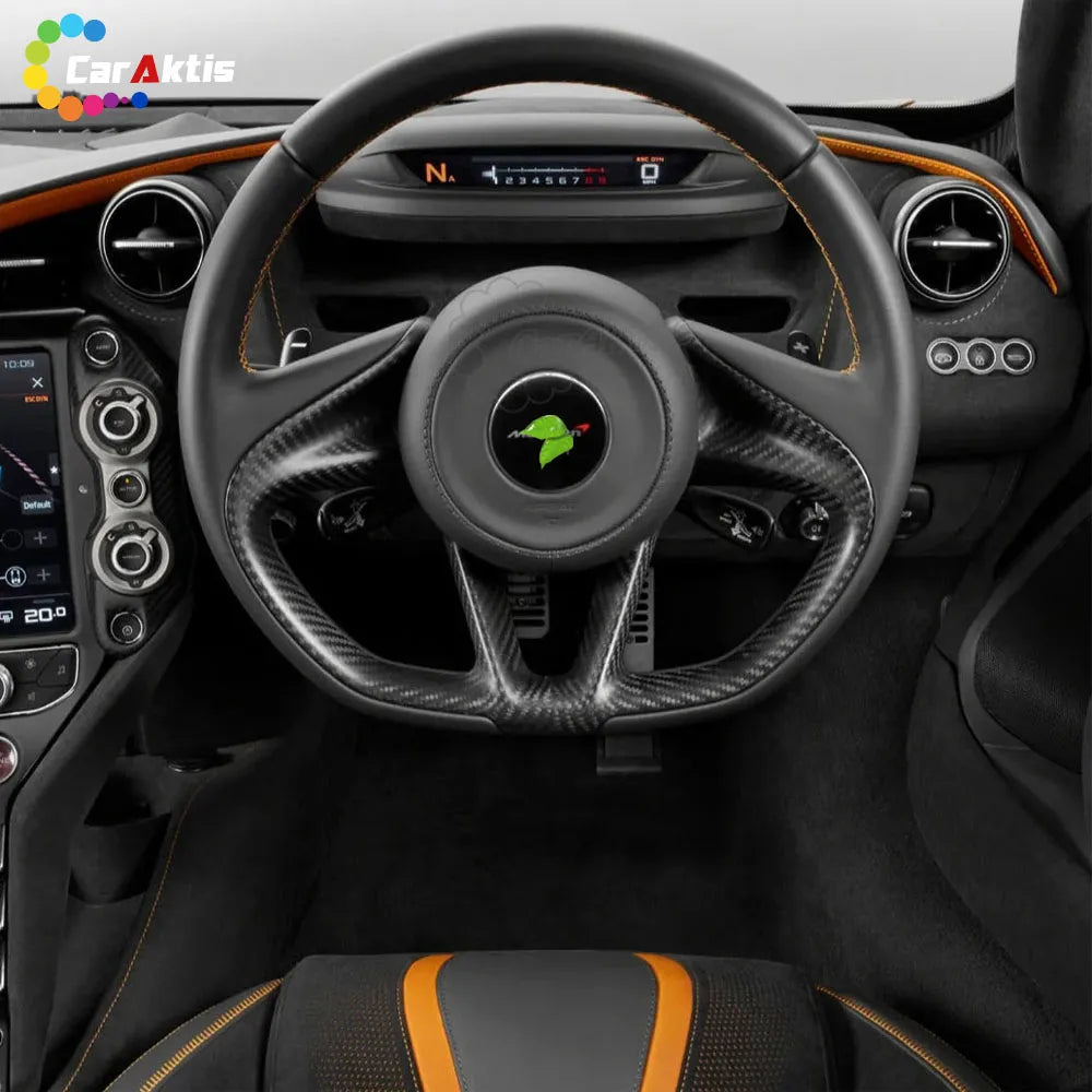 Interior view of a McLaren 720S cockpit showcasing a custom carbon fiber steering wheel with orange stitching.