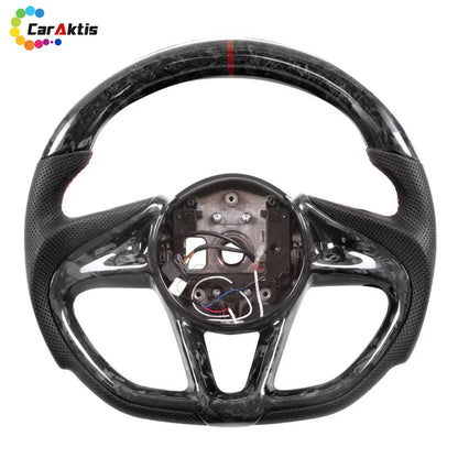Bespoke forged carbon fiber steering wheel for McLaren, featuring a red center stripe and ergonomic leather grips.
