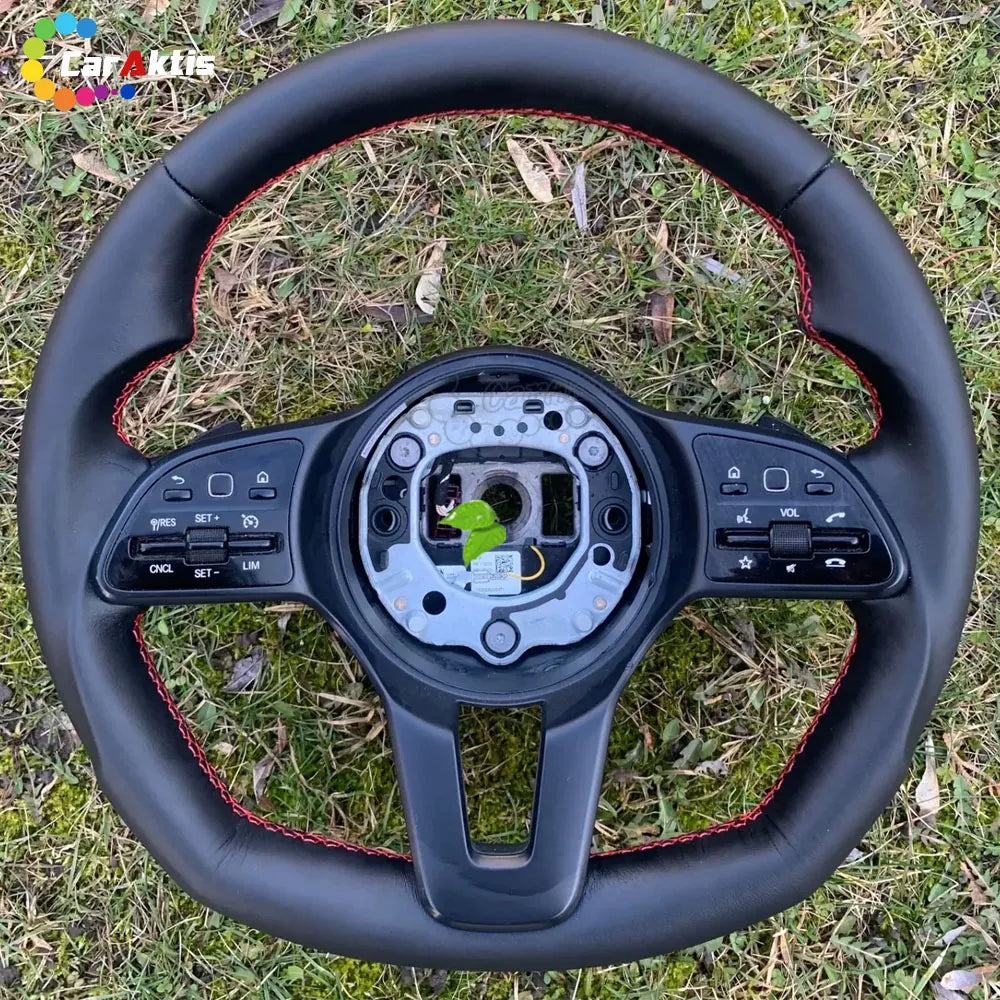 Upgraded leather steering wheel for Mercedes Sprinter W907 with sporty red contrast stitching and multi-function buttons.