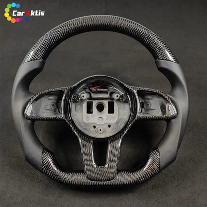 Custom carbon fiber and smooth black leather steering wheel for 2018+ Mercedes Sprinter W907/W910 models.