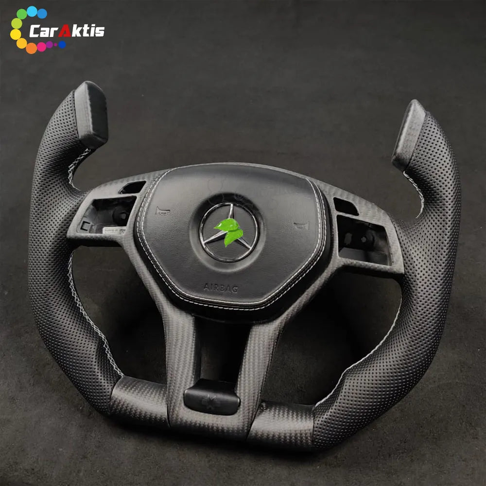 Front view of the custom Yoke steering wheel for Mercedes C-Class with premium perforated leather grips.