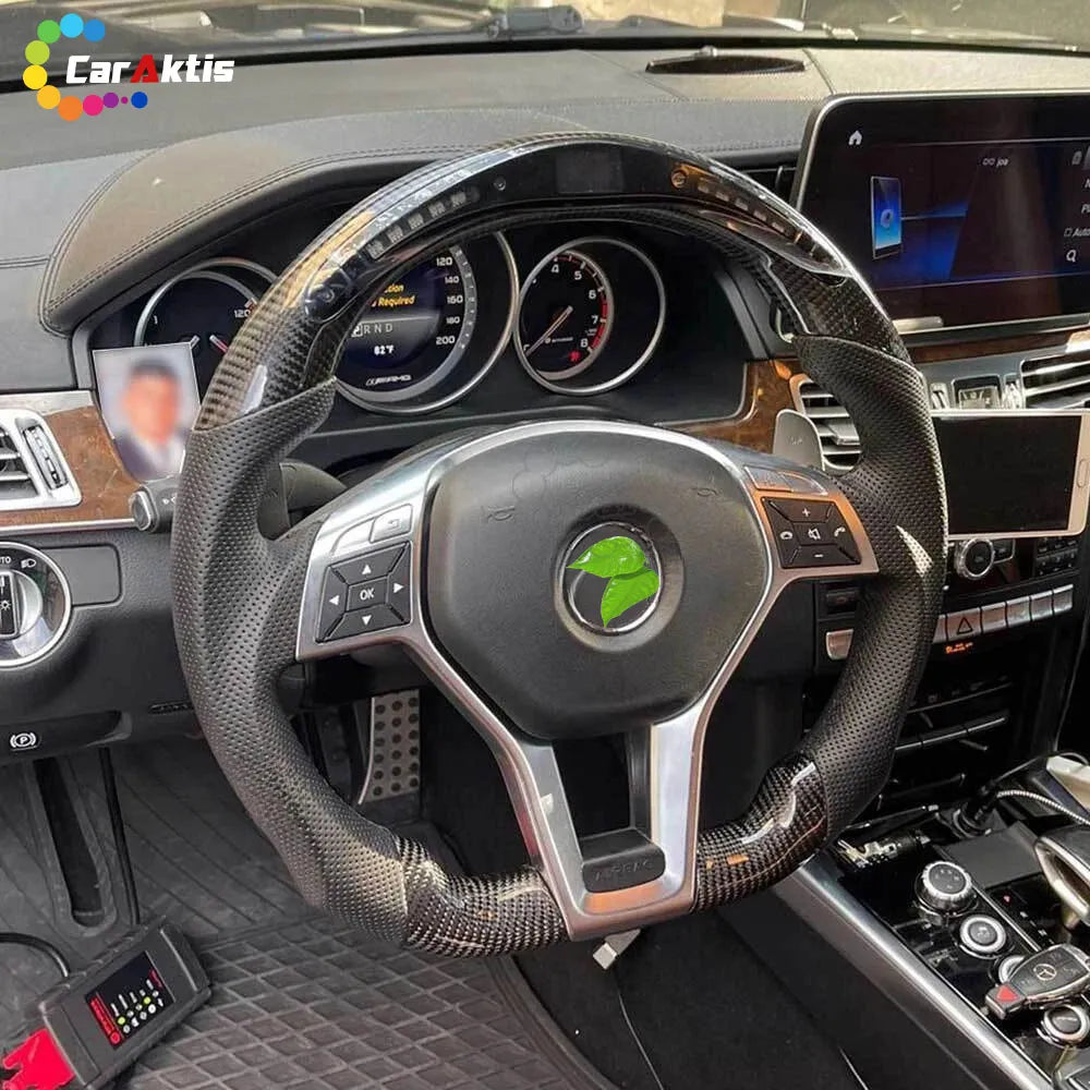 Mercedes W212 W204 custom steering wheel featuring glossy carbon fiber and top LED shift light display.