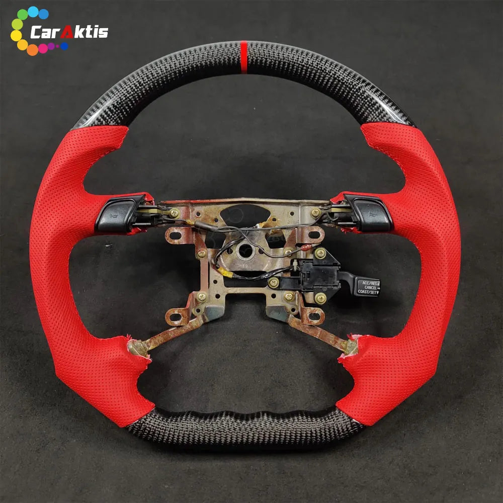 Mitsubishi 3000GT custom steering wheel frame with vibrant red perforated leather side grips and carbon fiber top/bottom.