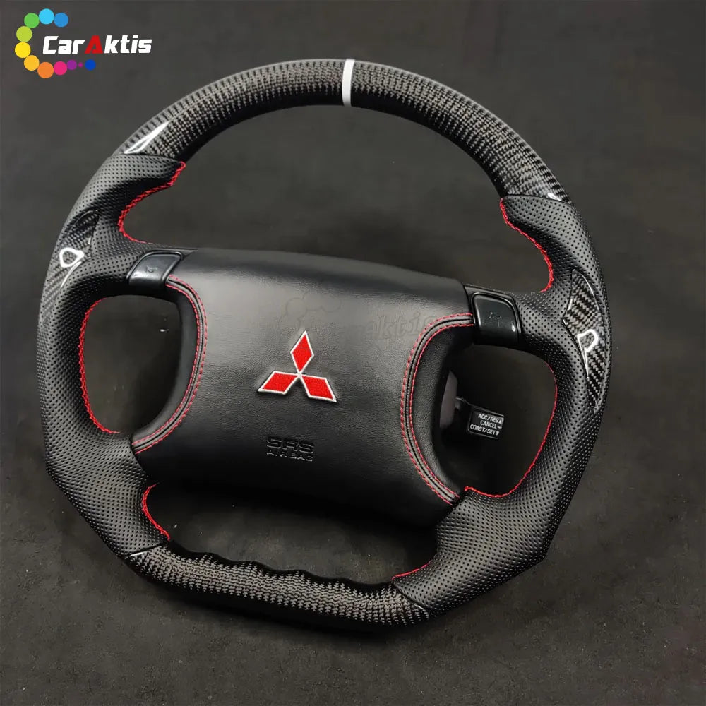 Performance steering wheel for Mitsubishi 3000GT GTO with a white center stripe and Mitsubishi red diamond logo.