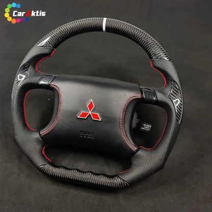 Performance steering wheel for Mitsubishi 3000GT GTO with a white center stripe and Mitsubishi red diamond logo.