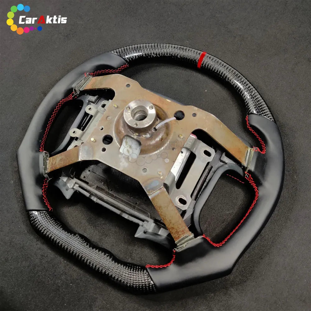 Back view of the Mitsubishi GTO custom steering wheel showing the high-quality core and carbon fiber finish.
