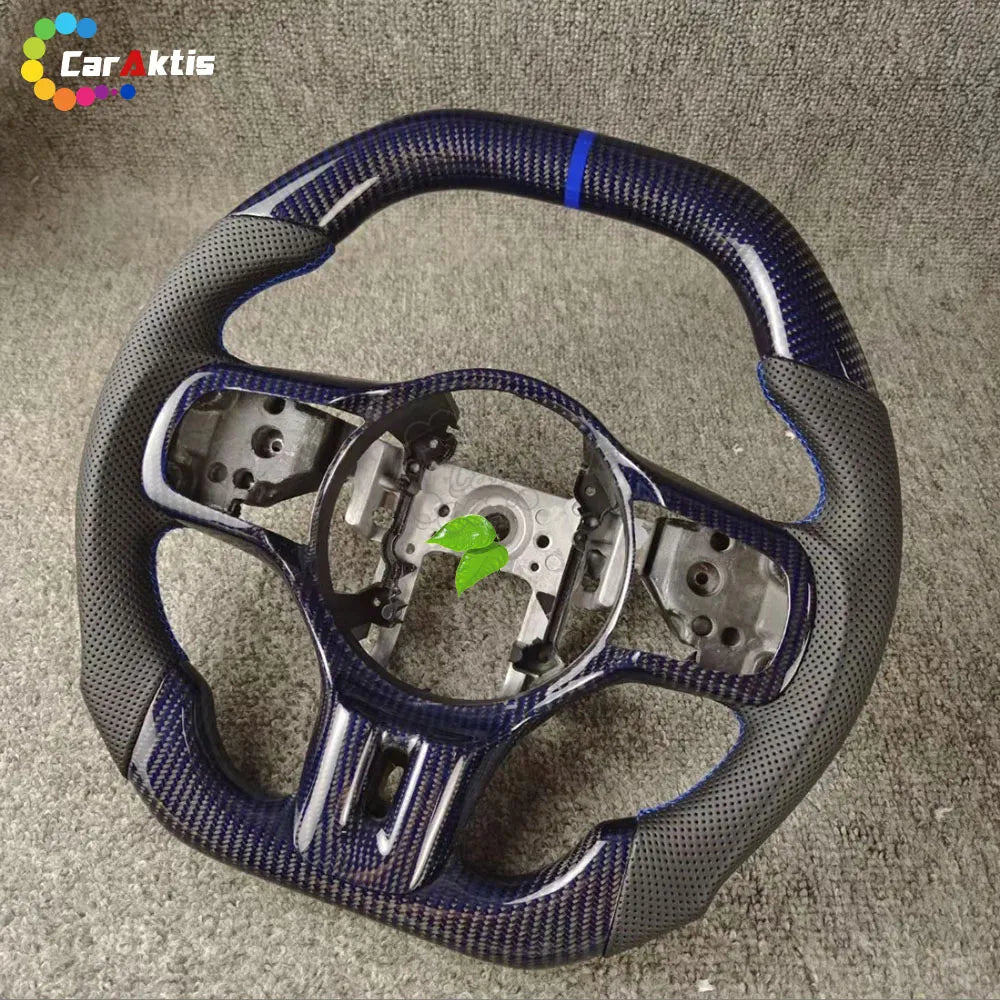 Custom Mitsubishi Lancer Evo X steering wheel featuring blue tinted carbon fiber and black leather grips.