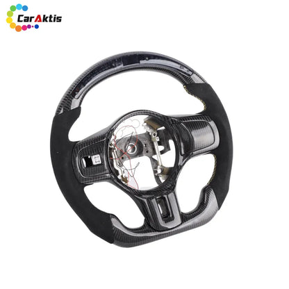 Mitsubishi Lancer Evo X carbon fiber steering wheel with black Alcantara grips and yellow contrast stitching.