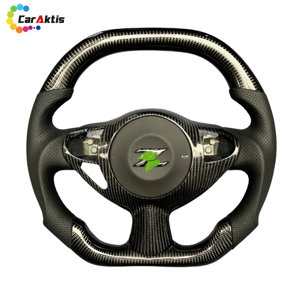 Performance Nissan 370Z steering wheel in high-gloss carbon fiber with black perforated leather and silver stitching.