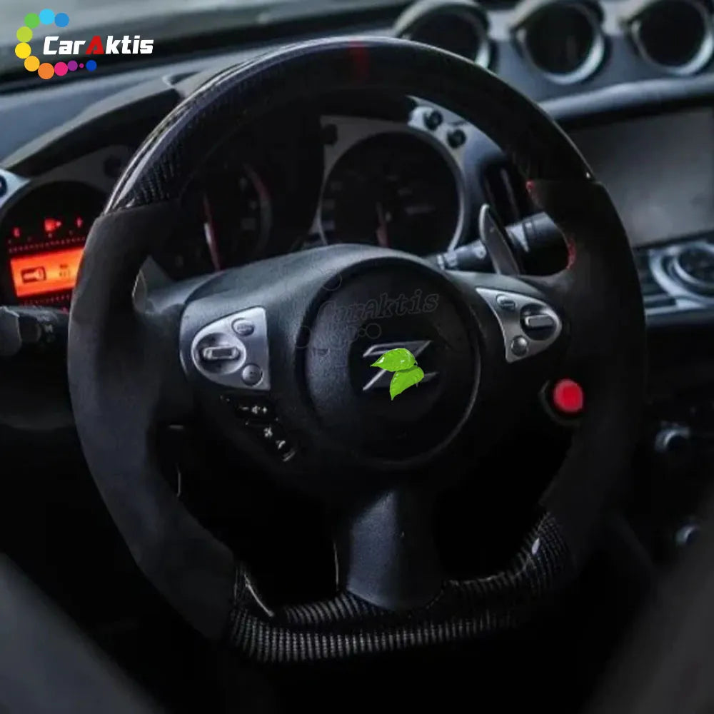 Installed view of a custom carbon fiber steering wheel in a Nissan 370Z interior with black suede grips.