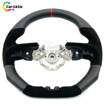 Flat bottom steering wheel for Nissan GTR R35 in matte carbon fiber and black Alcantara with red center line.