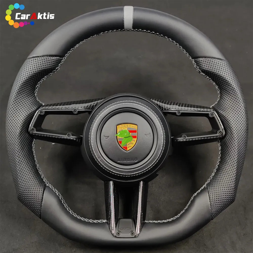 Custom Porsche carbon fiber steering wheel with black perforated leather, grey center stripe, and GTS trim logo.