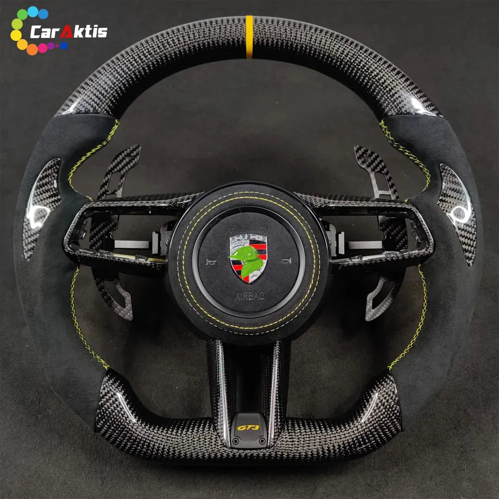 Porsche 911 992 GT3 custom carbon fiber steering wheel with black Alcantara, yellow stitching, and 12 o&