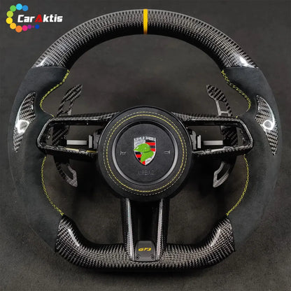 Porsche 911 992 GT3 custom carbon fiber steering wheel with black Alcantara, yellow stitching, and 12 o&