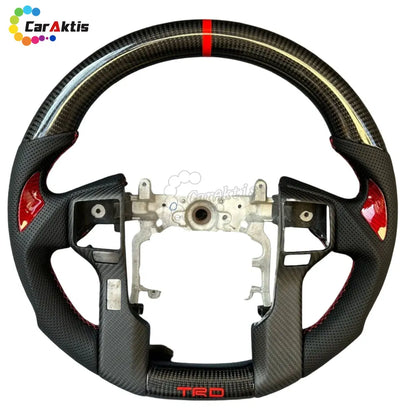 Custom carbon fiber steering wheel for Toyota Tacoma, Tundra, and 4Runner models.