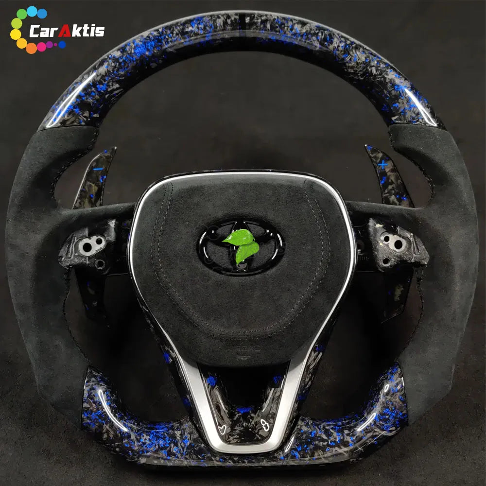 Close-up of unique blue forged carbon fiber finish with a high-gloss coating on a custom steering wheel.