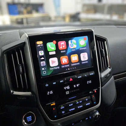 Close-up view of Apple CarPlay interface displayed on a Toyota Land Cruiser dashboard screen showing various iOS apps.