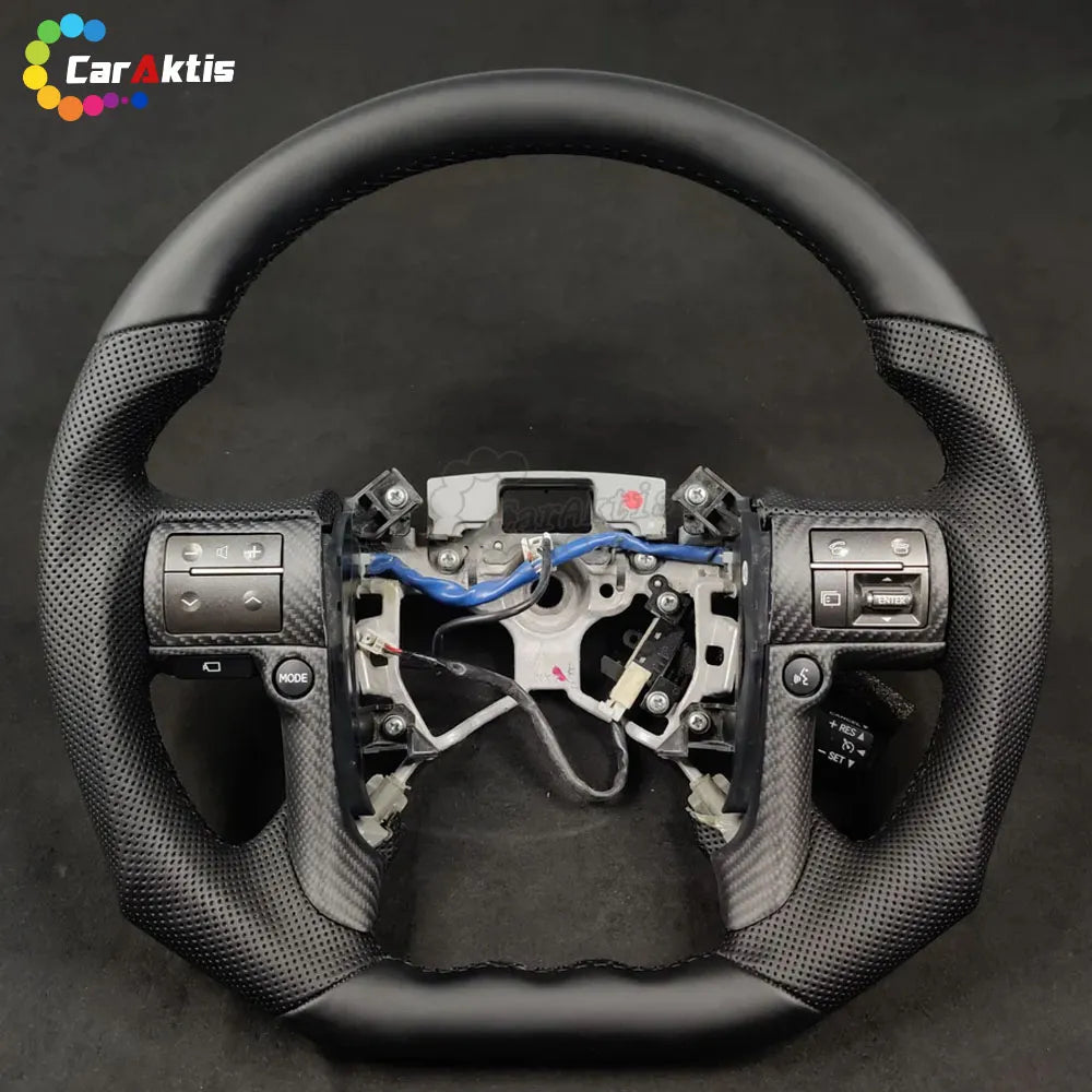 Ergonomic flat-bottom carbon fiber steering wheel designed for Toyota Tundra drivers.