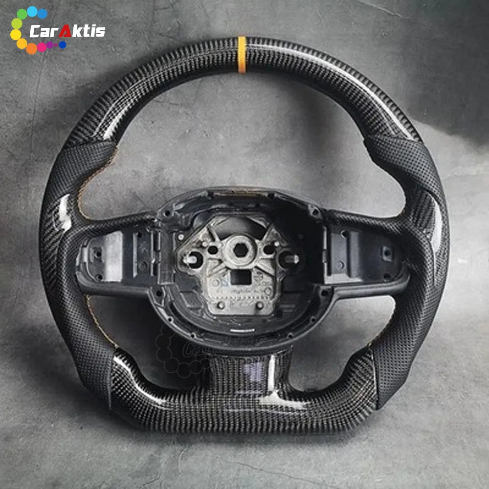 Custom carbon fiber steering wheel for Volvo XC90 XC60 V60 with orange center stripe and perforated leather grips.