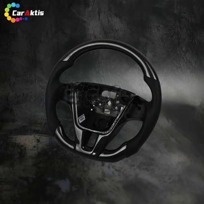 Side profile of ergonomic carbon fiber steering wheel for Volvo, showcasing the contoured grips and high-gloss finish.