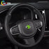 Interior view of a Volvo XC60 equipped with a glossy carbon fiber and leather steering wheel, showing airbag and button integration.