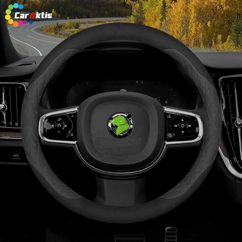Close-up of a customized Volvo steering wheel with diamond-patterned side grips and sleek black trim for XC90 and XC40.
