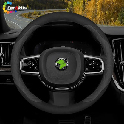 Close-up of a customized Volvo steering wheel with diamond-patterned side grips and sleek black trim for XC90 and XC40.